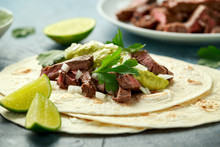 Carne Asada Tacos With Grilled Steak, Green Sauce And Onion. Mexican Food