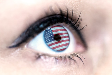 Flag of USA reflects in a woman blue eye - election, sport, hope, young, generation, pride, dream, emotion, independance	