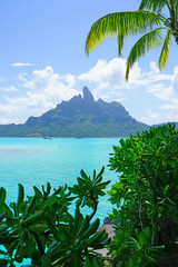 Wall Mural - View of the Mont Otemanu mountain reflecting in water in Bora Bora, French Polynesia, South Pacific