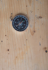 compass on wooden table
