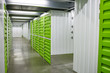Image of empty warehouse with green chambers for boxes