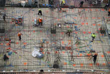 New York, New York: Aerial View Of Men And Materials During The Construction Of A 42-story High-rise Apartment Building In Midtown Manhattan, New York City.
