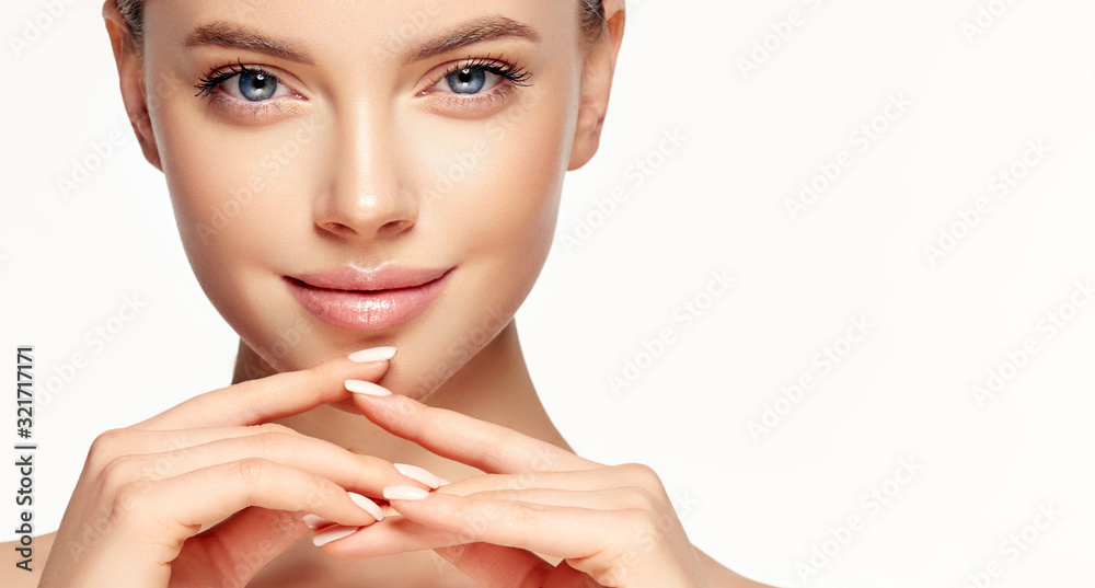 Beautiful young woman with clean fresh skin touching her face . Girl ...