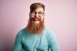 © Krakenimages.com - Handsome Irish redhead man with beard wearing glasses over pink isolated background smiling and laughing hard out loud because funny crazy joke with hands on body.