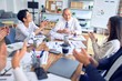 © Krakenimages.com - Group of business workers smiling happy and confident. Working together with smile on face applauding one of them at the office