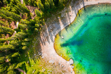 Wall Mural - top down view of carezza lake in dolomites, italy, europe