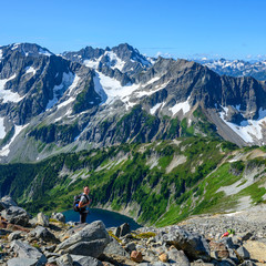 Poster - Female Hiker Looks Up from Overview of Lake