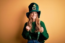 Beautiful Brunette Woman Wearing Green Hat With Clover Celebrating Saint Patricks Day Excited For Success With Arms Raised And Eyes Closed Celebrating Victory Smiling. Winner Concept.