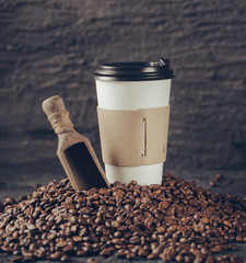 Poster - Ground coffee and coffee beans on old cafe table.