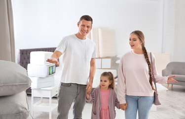 Wall Mural - Happy family choosing cushion in mattress store