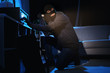 © New Africa - Thief with flashlight near steel safe indoors at night