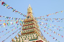 Colorful Triangle Party Flags On Sky Background For Decoration At Temple Thailand.