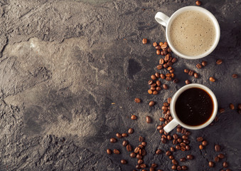 Poster - Ground coffee and coffee beans on old cafe table.