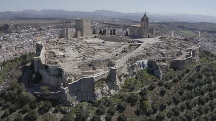 Poster - D-log aerial footage of Alcala de Real medieval fortified hilltop castle and church in Andalusia Spain