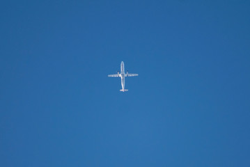 Passenger Turbo Props at high altitude on a blue sky