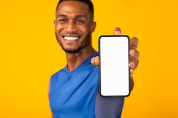 Black millennial gman showing white blank phone