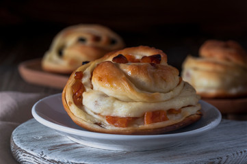 Kraffins with raisins and dried apricots, smeared with sugar - honey syrup.