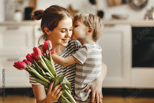 Cuadros en Lienzo happy mother's day! child son gives flowers for mother on holiday