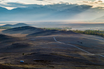 Wall Mural - Morning in the Kurai steppe, dirt road through the hills. Kosh-Agachsky District, Altai Republic, Russia