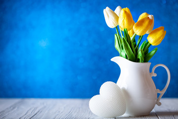 Wall Mural - greeting card with flowers and heart. background with copy space. selective focus.