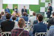 © Anton Gvozdikov - Business conference attendees sit and listen