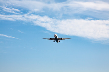 an airplane landing in the sky