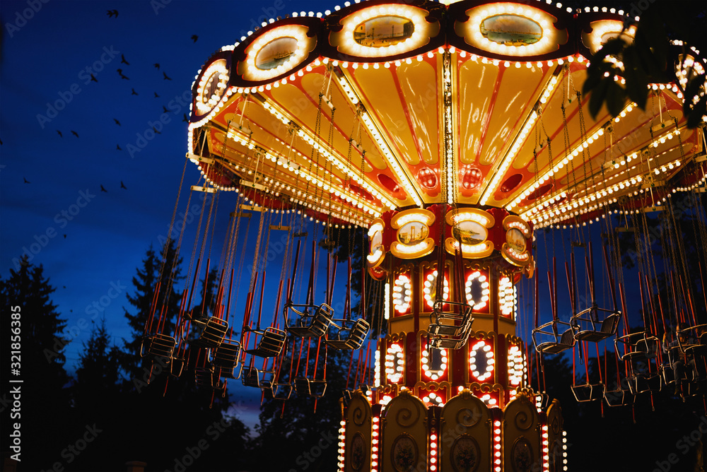 Carousel Merry-go-round in amusement park at a night city - obrazy, fototapety, plakaty 
