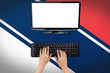 Mockup image of a person using a keyboard with a blank white desktop computer screen 