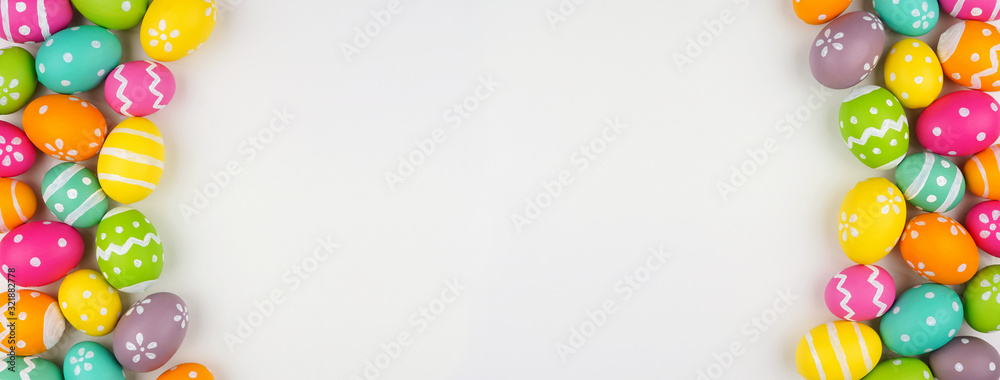 Easter banner with colorful Easter Egg double side border over a white background. Top view with copy space. - obrazy, fototapety, plakaty 