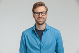 happy young model wearing glasses and smiling