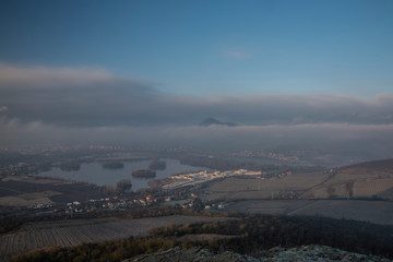 Wall Mural - Sunrise time on Radobyl hill over valley of river Labe and Lovosice town