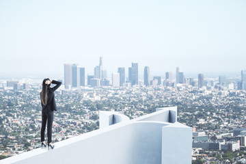 Wall Mural - Businesswoman standing on abstract white arrow