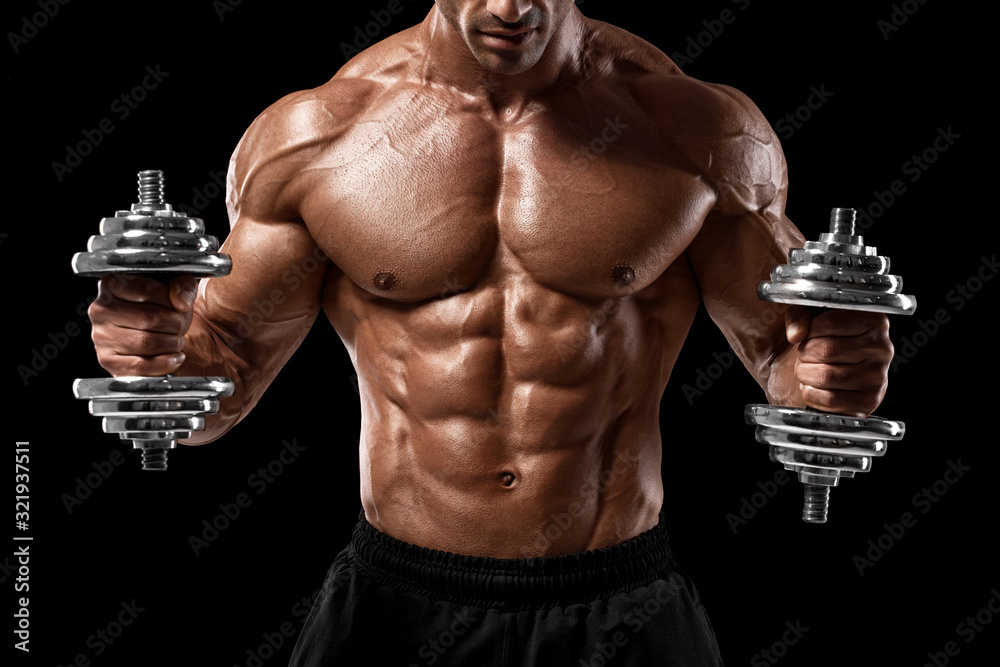 Muscular man showing muscles and abs isolated on black background. Strong male naked torso working out - obrazy, fototapety, plakaty 