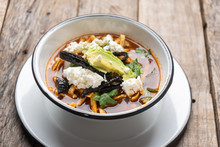 Mexican Tortilla Soup Also Called "azteca" On Wooden Background