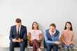 © Pixel-Shot - Young people waiting for job interview indoors