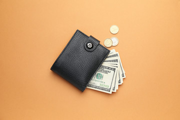 Wallet with money on color background. Savings concept