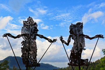 Wall Mural - Black shadow silhouette of traditional Balinese puppets Wayang Kulit