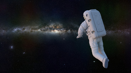 Wall Mural - astronaut in outer space flying towards the stars