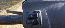 The Low Beam And High Beam Switches And Panels Close Up Of A Two Wheeler Scooter .