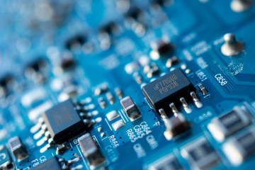 Close up macro shooting computer circuit mainboard integrated elements. Shallow depth of field. Science and technology concept.