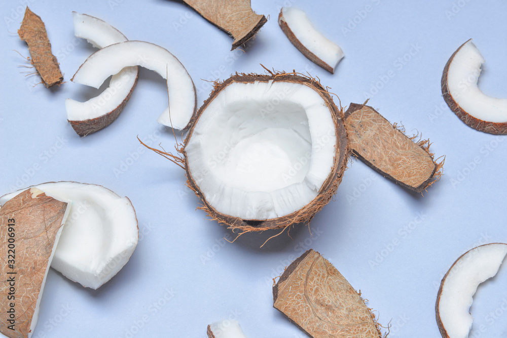 Ripe coconuts on color background