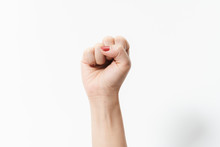 Woman's Hands With Fist Gesture On A White Background
