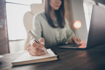 Wall Mural - Cropped view portrait of nice attractive busy lady qualified expert shark lawyer attorney specialist writing case notes researching at modern industrial brick loft interior style work place station