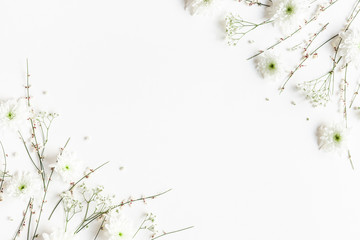 Wall Mural - Flowers composition. White flowers on white background. Spring concept. Flat lay, top view, copy space