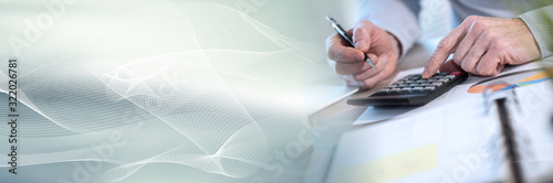 Cuadros en Lienzo Businessman working on financial data; panoramic banner