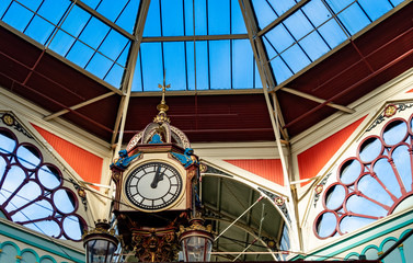 Clock tower under an old market glass roof in Halifax