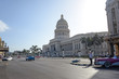Capitol Building and blue retro car on the road in Havana, Cuba