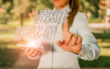 Fototapete - Text sign showing Website Check Up. Business photo text an examination of a website to see if something is in order Woman in a blue business shirts pointing with her finger into empty space