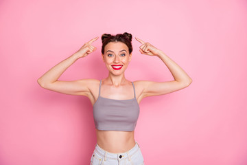Wall Mural - Portrait of positive cheerful girl point index finger top-knot feel inspired haircare prom party preparation wear casual style clothing isolated over pastel color background