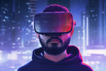 Wall Mural - Man wearing virtual reality headset